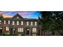 Townhouse exterior at twilight showcasing the architectural details and landscaped front yard at 2281 Millhaven Se St # 18, Smyrna, GA 30080