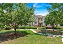 Beautiful townhome with a lush green lawn, mature trees, and a charming walkway at 2281 Millhaven Se St # 18, Smyrna, GA 30080