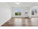 Open living room with hardwood floors, lots of natural light, and modern interior finishes at 326 Oakview Way, Canton, GA 30114
