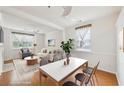 Bright and airy living and dining area with hardwood floors and lots of natural light at 106 Weatherstone Square Drive, Woodstock, GA 30188