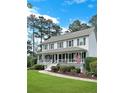 Charming two-story home featuring a large front porch, beautiful landscaping, and a welcoming atmosphere at 21 Picketts Ridge Ln, Acworth, GA 30101