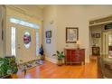 Welcoming foyer with hardwood floors, a decorative front door, and a view into the home at 410 Fitzgerald Ln, Fayetteville, GA 30215