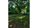 Large, grassy backyard featuring shade trees at 1167 Oakland Sw Dr, Atlanta, GA 30310
