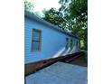 The exterior of this home features vinyl siding and manicured landscaping at 1167 Oakland Sw Dr, Atlanta, GA 30310
