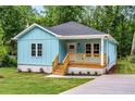 Charming light blue bungalow with a cozy front porch and newly landscaped front yard at 1317 Bernard Nw St, Atlanta, GA 30314