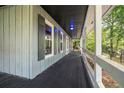 Inviting front porch with a swing, perfect for relaxing and enjoying the outdoors at 3392 Inns Brook Way, Snellville, GA 30039