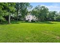 Charming home with a lush, sprawling green lawn and mature trees providing ample shade at 5290 River Mill Cir, Marietta, GA 30068