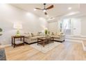 A bright living room features wood floors, neutral paint, and two sofas for ample seating at 2012 Variations Ne Dr, Atlanta, GA 30329