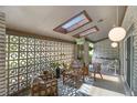Cozy covered patio with skylights, comfortable seating, and unique brick accents at 4020 N Cooper Lake Se Rd, Smyrna, GA 30082