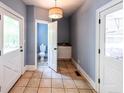 Open mud room leads to a half bath and an additional sink and counterspace at 5780 Punkintown Rd, Douglasville, GA 30135