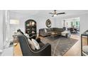 Inviting living room with comfortable seating, stylish decor, and a large window at 403 Defoors Mill Nw Dr, Atlanta, GA 30318