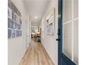 Inviting entryway featuring beautiful wood floors, modern decor, and a view into the living area at 1019 Merritt Dr # 102, Villa Rica, GA 30180