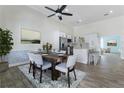 Open-concept kitchen and dining area with modern appliances and ample seating at 1491 Black Hickory Pl, Norcross, GA 30093