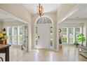 Grand foyer with tile flooring, arched doorway, and natural light at 230 Bristol Stone Ct, Johns Creek, GA 30005