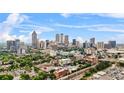 Scenic aerial view of downtown skyline with lush greenery in the foreground, emphasizing urban living at 434 Marietta St Nw # 401, Atlanta, GA 30313