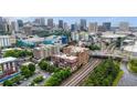 Cityscape featuring building, railroad tracks, lush green trees, and urban skyline with many buildings at 434 Marietta St Nw # 401, Atlanta, GA 30313