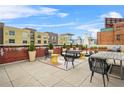 Stylish rooftop deck with modern outdoor furniture and greenery, offering a relaxing city view at 434 Marietta St Nw # 401, Atlanta, GA 30313
