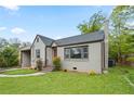 Side view of a single-Gathering home featuring a carport at 664 Florence Nw Pl, Atlanta, GA 30318