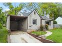 A view of the side of a single story home featuring a carport at 664 Florence Nw Pl, Atlanta, GA 30318