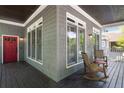 Inviting porch with rocking chairs, providing a cozy space for relaxation and outdoor enjoyment at 1003 North Ne Ave, Atlanta, GA 30306