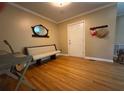 Cozy entryway featuring gleaming wood floors, a comfortable bench, and a welcoming atmosphere at 224 Sourwood Dr, Marietta, GA 30062