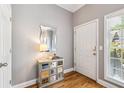 Welcoming entryway with hardwood floors, a decorative mirror and storage console at 3150 Stonewyck Pl, Decatur, GA 30033
