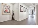 Hallway showcasing modern artwork, a sculpture, and tile flooring leading to other areas at 75 14Th St Ne # 4140, Atlanta, GA 30309