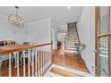 Inviting foyer with hardwood floors, staircase, and a view into other rooms at 1211 Riverscall Ln, Atlanta, GA 30339