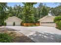 Spacious multi-car garage with a long driveway, offering plenty of parking and storage space at 5401 Rosser Rd, Tucker, GA 30087