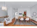 Bright dining room with wood table, white chairs, and access to other rooms at 611 Parkside Village Nw Way, Marietta, GA 30060