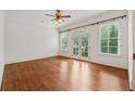 Bedroom featuring hardwood floors, large windows and a balcony access at 1220 State Nw St, Atlanta, GA 30318