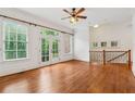 Bedroom features hardwood floors, fan, many windows and a balcony access at 1220 State Nw St, Atlanta, GA 30318