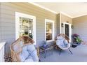 Inviting front porch with cozy seating, plants, and charming curb appeal at 2167 Tilson Rd, Decatur, GA 30032