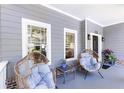 Relaxing front porch with comfortable seating, offering a peaceful outdoor retreat and curb appeal at 2167 Tilson Rd, Decatur, GA 30032