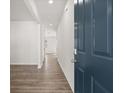 Inviting entryway showcasing luxury vinyl plank flooring and a modern blue front door at 3042 Manor Hill Pl, Union City, GA 30291