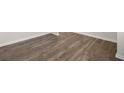 Close-up showcasing the luxury vinyl plank flooring with white trim and neutral decor at 3042 Manor Hill Pl, Union City, GA 30291