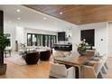 Spacious living room with hardwood floors, recessed lights, and an open floor plan into the kitchen at 4132 Carmain Ne Dr, Atlanta, GA 30342