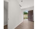 Light-filled foyer featuring wood-look floors and a view of the front yard through the front door at 3048 Manor Hill Pl, Union City, GA 30291