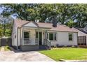 Attractive single-Gathering home with a cozy front porch, lush green lawn, and inviting entrance at 139 Sisson Ne Ave, Atlanta, GA 30317
