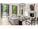 Bright, stylish living room with high ceilings, modern lighting, and French doors overlooking the yard at 4560 Harris Trl, Atlanta, GA 30327