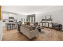 Spacious living room and connected kitchen featuring contemporary furnishings and ample natural light at 4954 Jatoba Rd # 72, Acworth, GA 30101