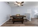 Cozy dining room featuring wood floors and modern table with seating for six at 16104 Waldrop Cv, Decatur, GA 30034