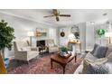 Inviting living room with a fireplace, stylish decor, and plenty of natural light at 2349 Northlake Ne Ct, Atlanta, GA 30345