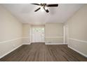 Inviting living room with modern flooring, fresh paint and ample natural light at 2895 Fairview Rd, Covington, GA 30016