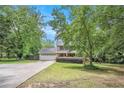 Charming two-story home featuring a covered front porch, attached garage, and well-manicured landscaping at 12510 Georgia 36, Covington, GA 30014