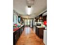 The kitchen features ample countertop space, wooden floors, and natural light at 2816 Quinbery Dr, Snellville, GA 30039