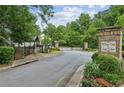 Welcoming entrance to White Oak at East Lake, with a gated entry and lush landscaping at 2817 White Oak Ln, Decatur, GA 30032