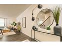 Inviting entryway featuring a modern mirror and decor, leading to an open-concept living space at 3050 Yellowhammer Dr, Marietta, GA 30064