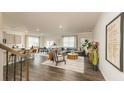 Bright and airy living room with a large sectional sofa, dining area, and modern finishes at 3050 Yellowhammer Dr, Marietta, GA 30064