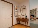 Stylishly decorated foyer with console table, mirror, and decor welcomes you into this inviting home at 2174 Kinridge Rd, Marietta, GA 30062